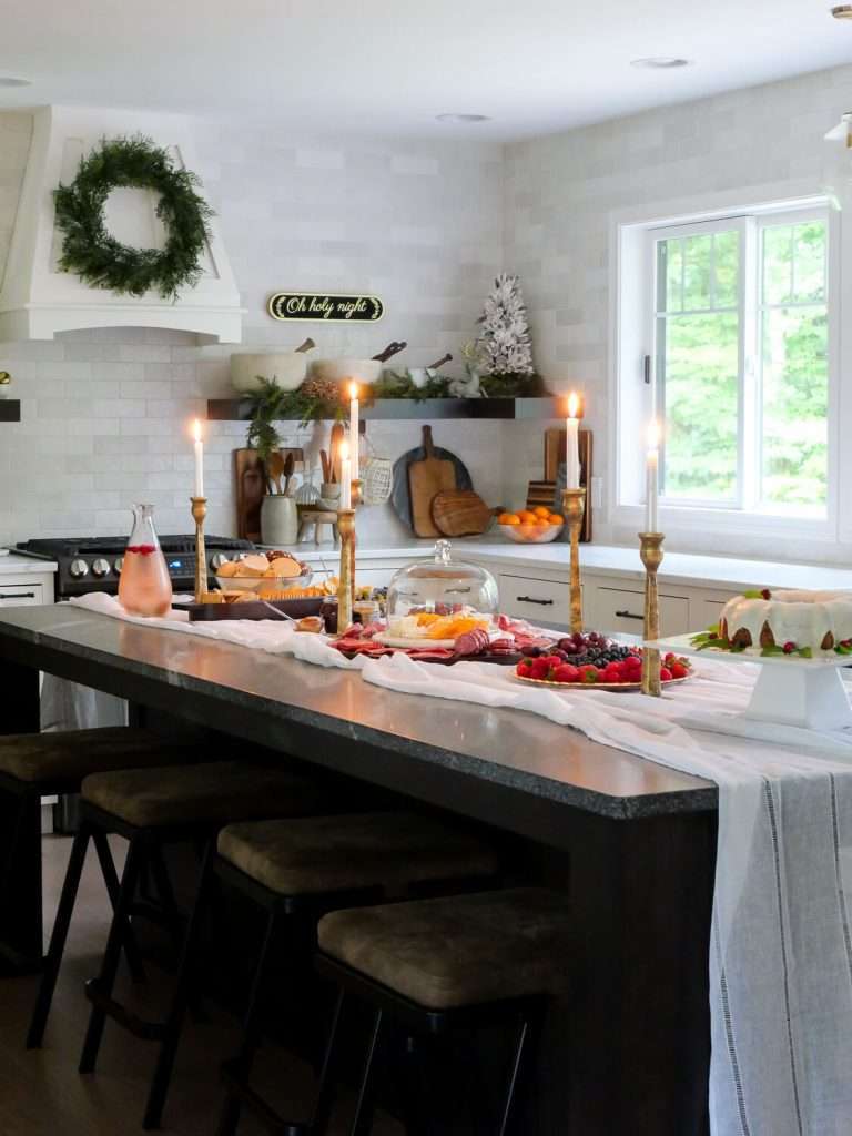 Taper candle centerpiece on a kitchen island.