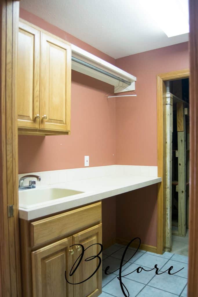 Oak cabinet in a laundry room.