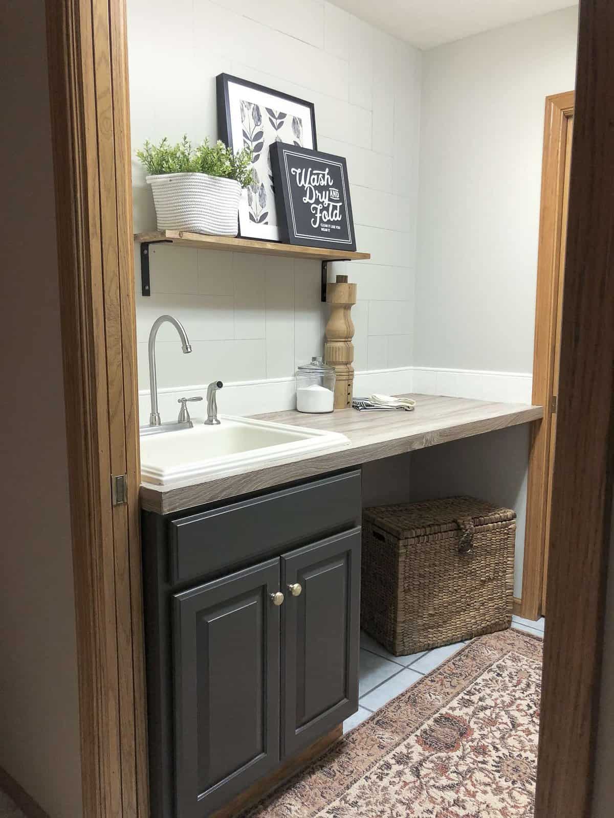 Is your laundry room in need of a facelift? See how I take my laundry room decor and more from dark and dated to beautiful form and function, all for $100!