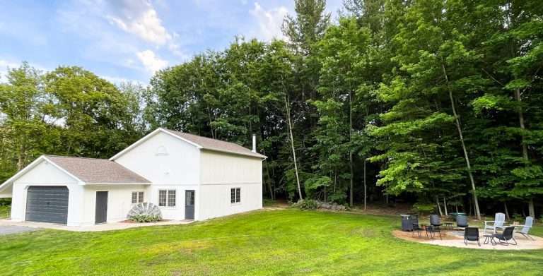 White barn with fire pit