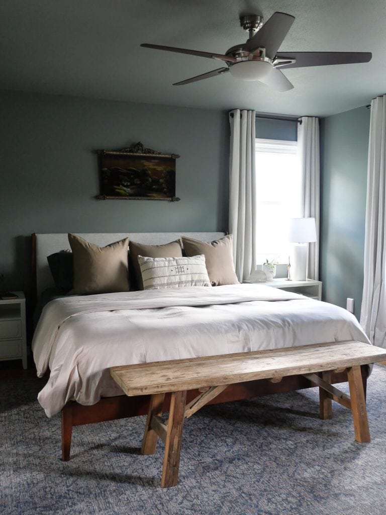 Bedroom painted with green walls and ceiling.