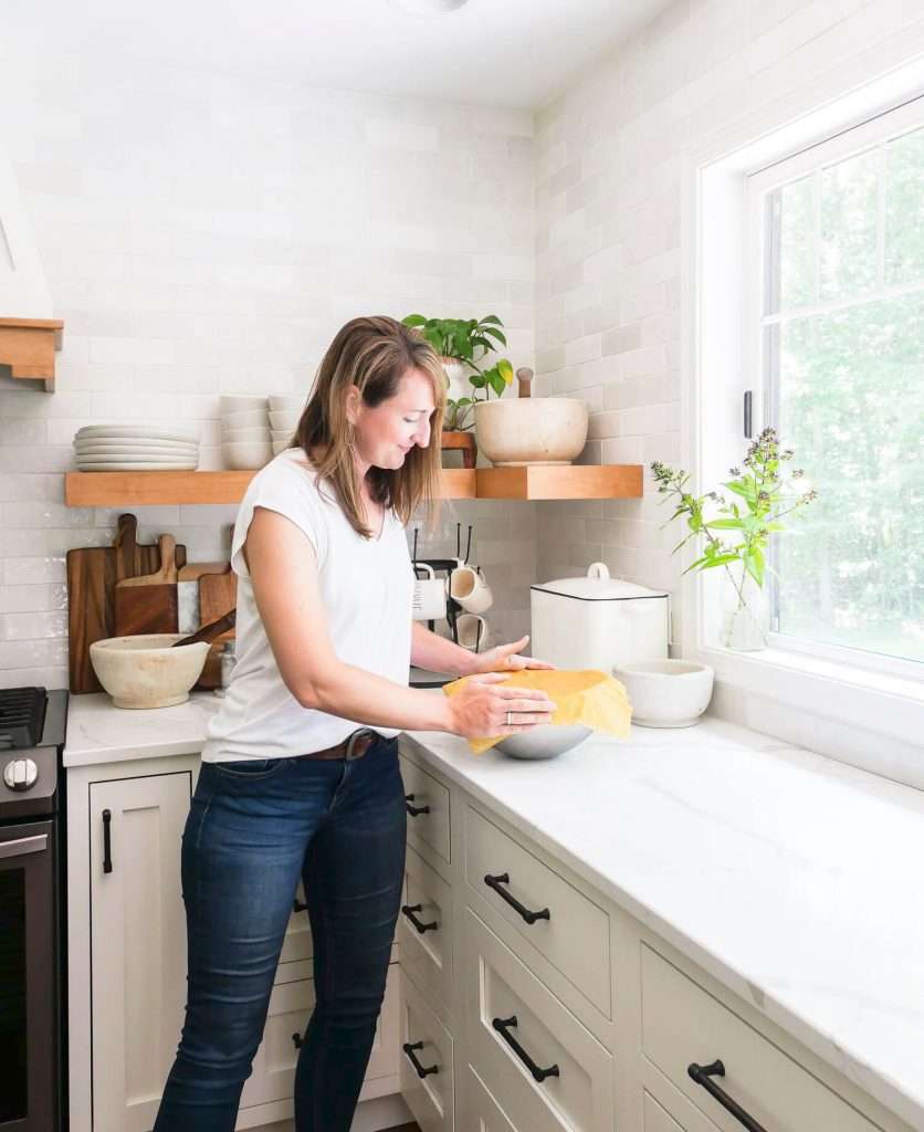 Woman in a kitchen with sustainable school supplies