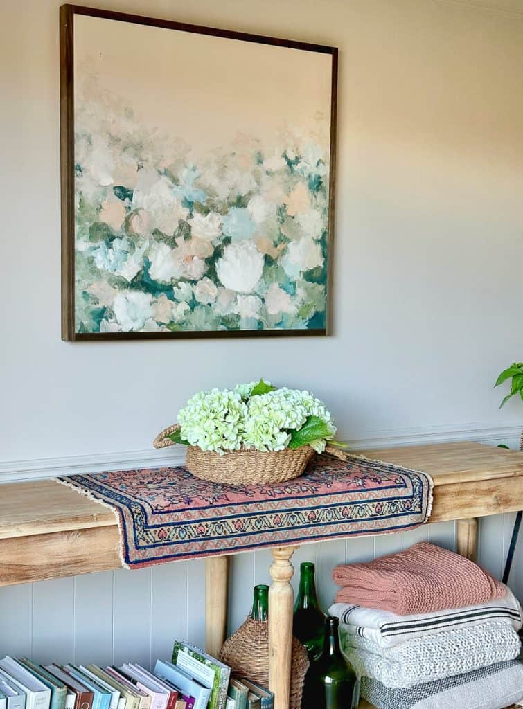 Hydrangea faux floral on a console table.