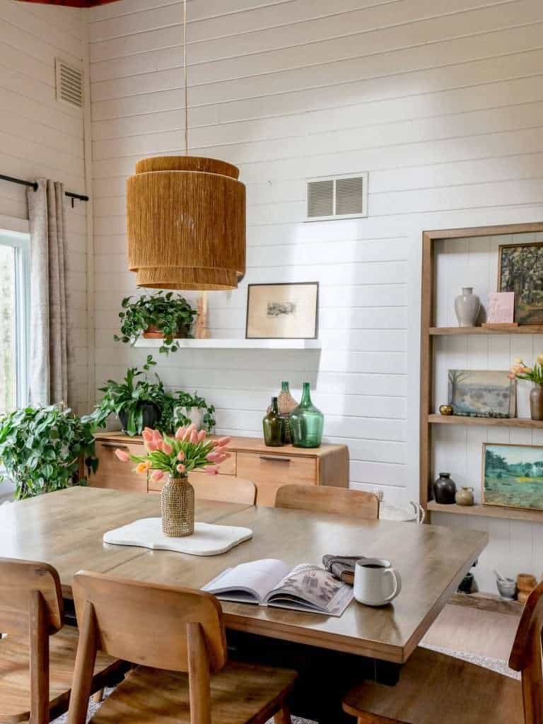 Dining room with book and coffee mug.