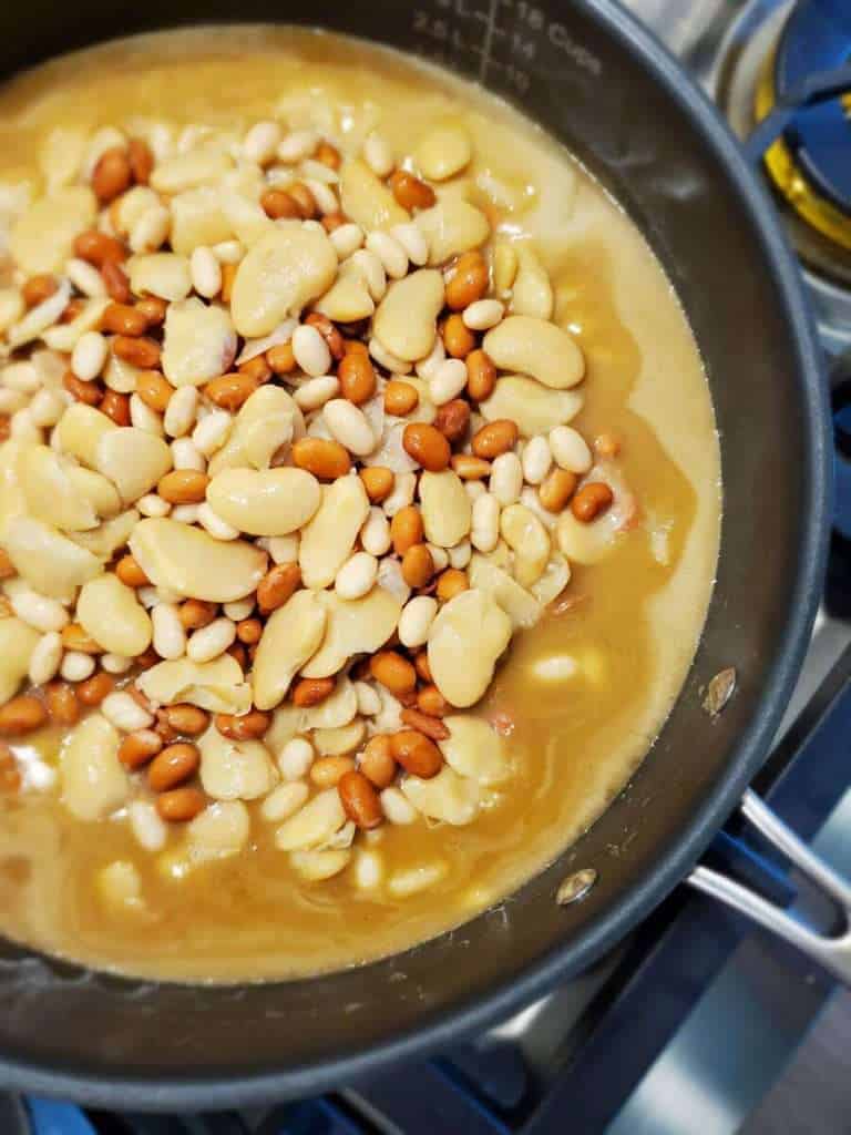 Sweet and spicy cowboy beans in a skillet.