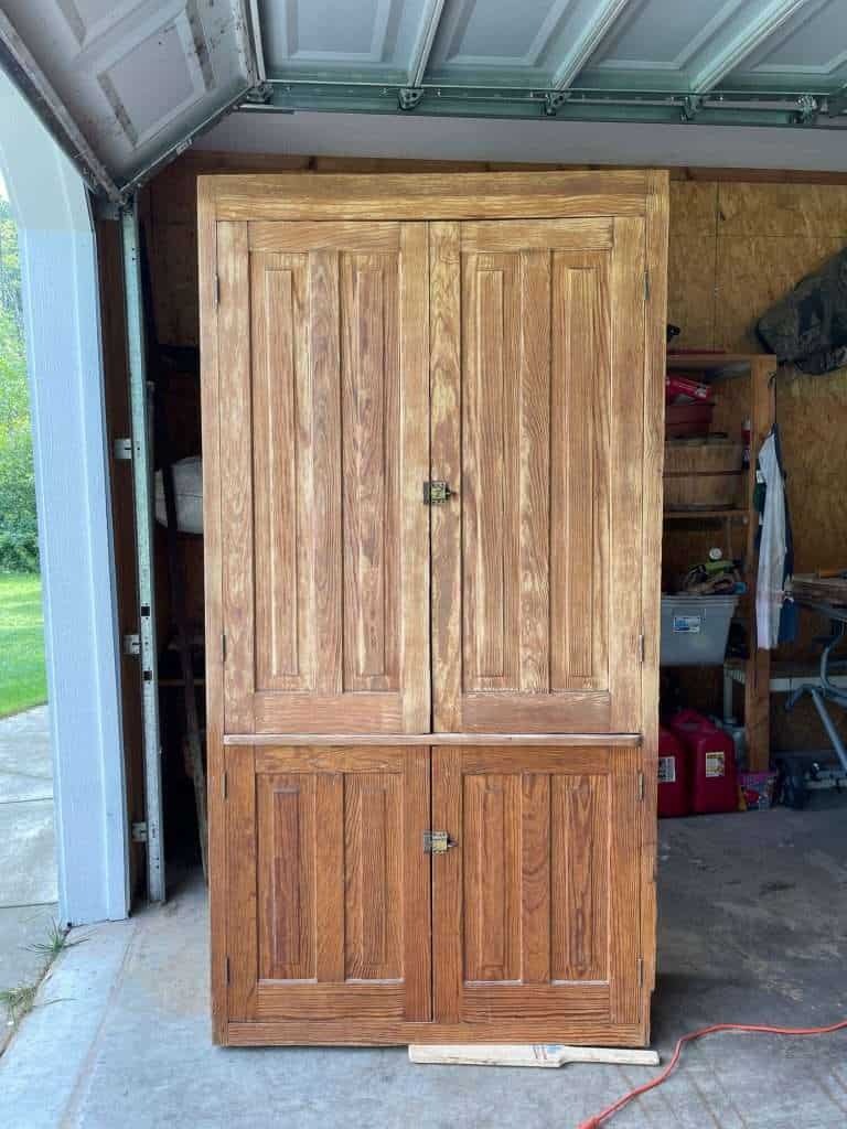 Two doors sanded on cabinet.