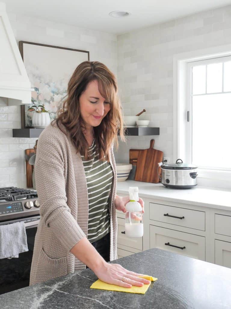 Woman wiping a counter with a swedish dishcloth