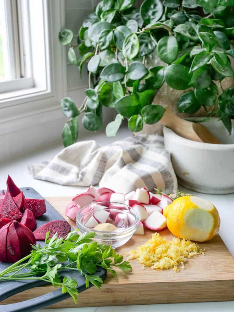 Cut up beets and radishes on a counter.