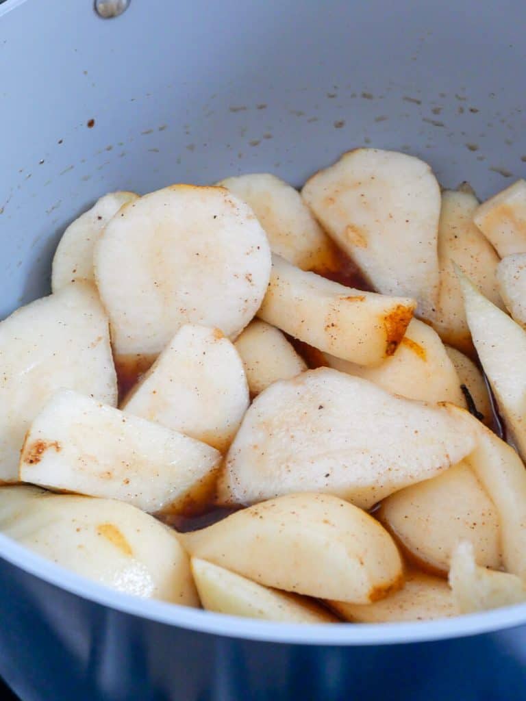 Sliced pears in a pot.