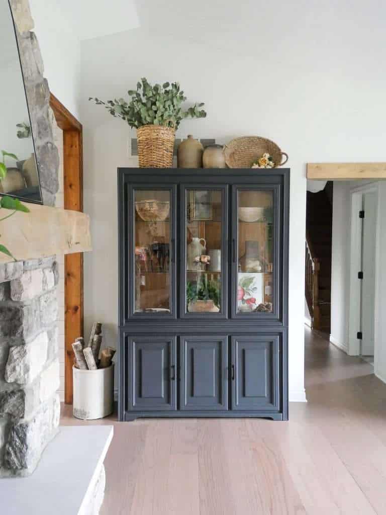 Black cabinet in a living room.