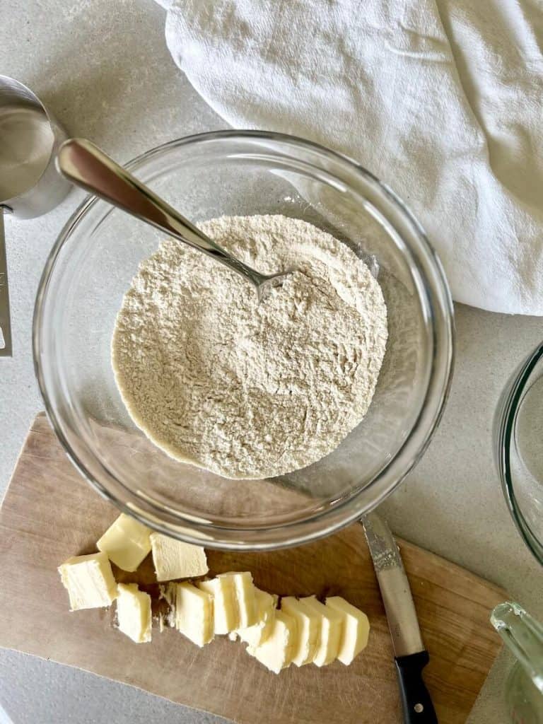 Blending together butter and dry ingredients.