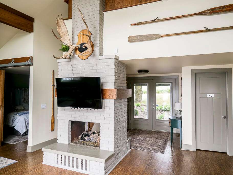 Flat screen TV on a fireplace.