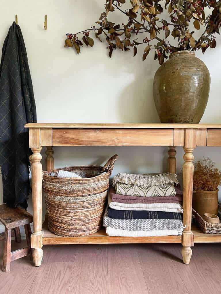 folded blankets under a table.