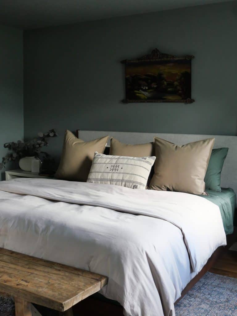 Fall bedding in a green bedroom.