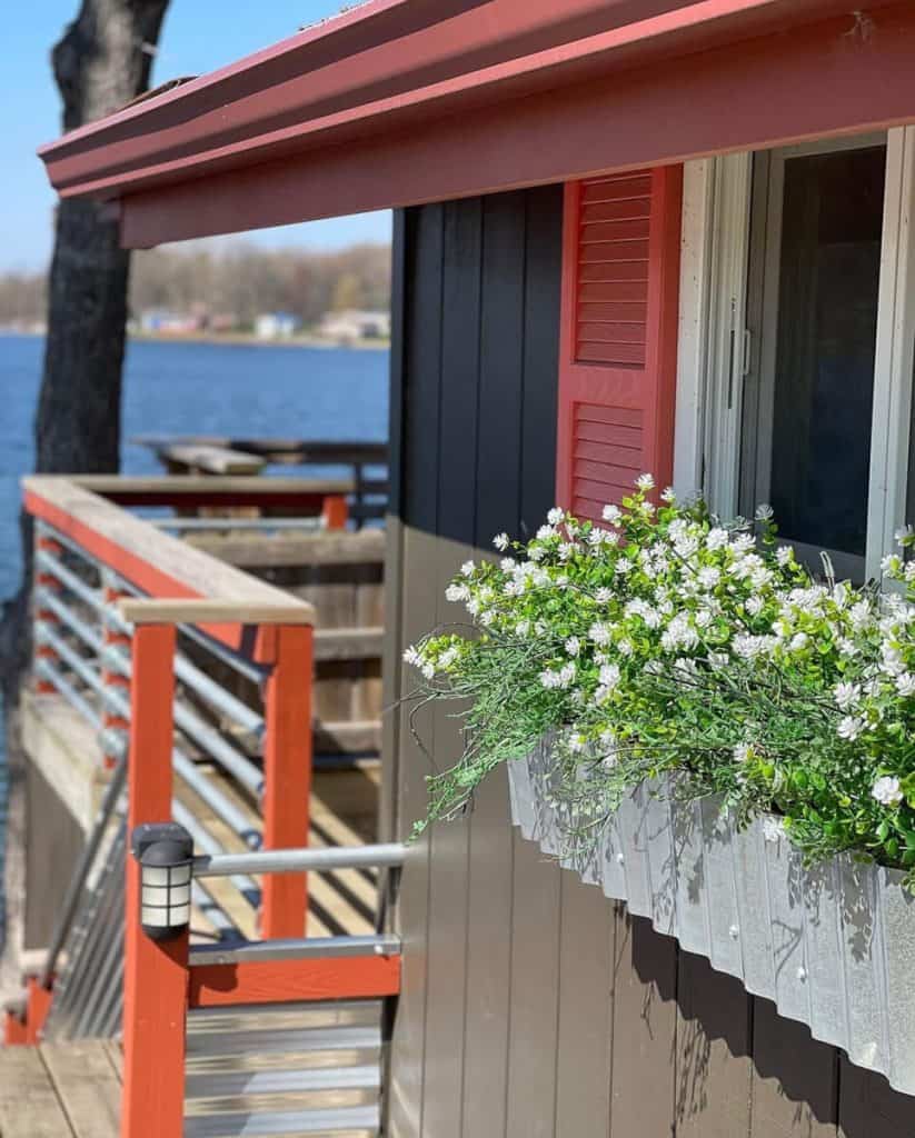 Faux plants in a window box.