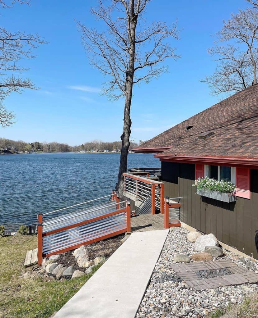 Lake cottage with window box of faux plants.