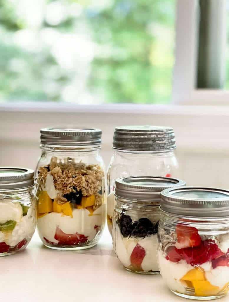 Parfait jars on a countertop.