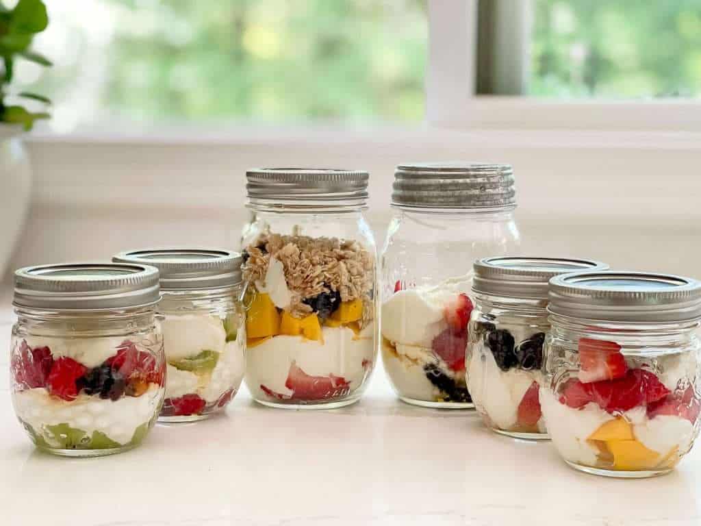 Jars of yogurt on a countertop.