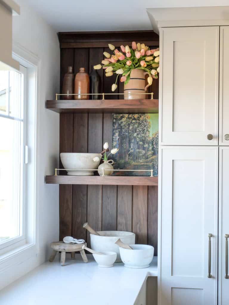 Tulips on a kitchen shelf.