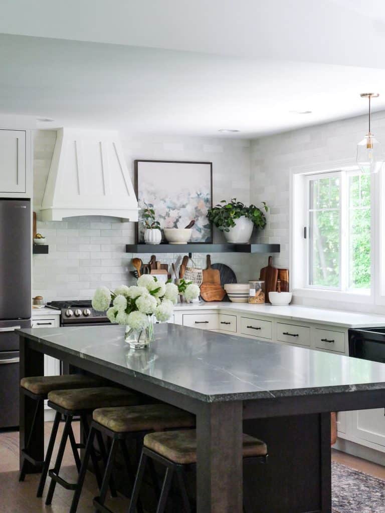 Kitchen island with tile backsplash.