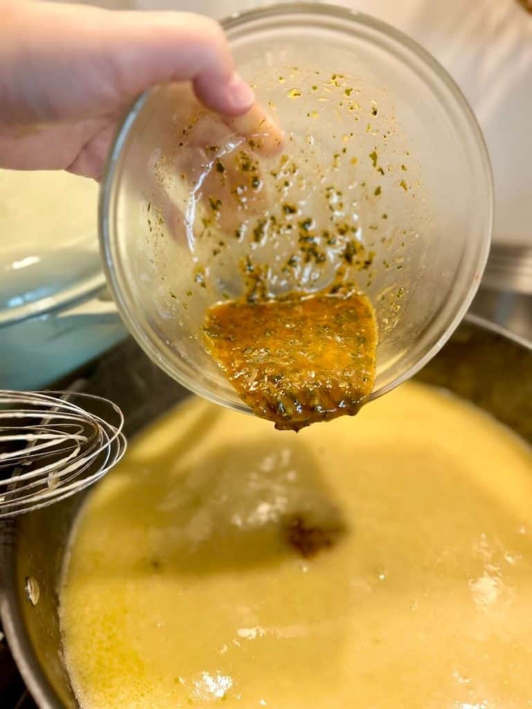 Making lemon basil chicken sauce.