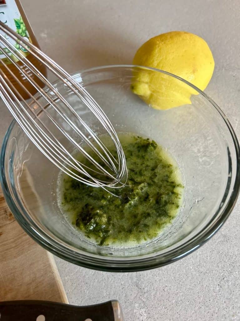 Whisk together basil and lemon.