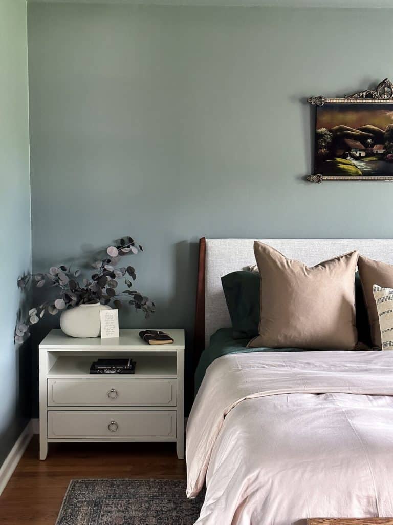 Bedroom with white nightstand.