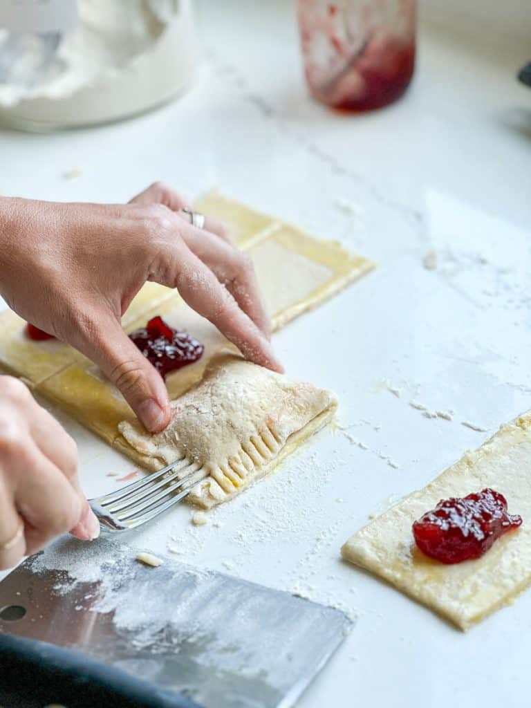 crimping edges of sourdough discard pop tarts.