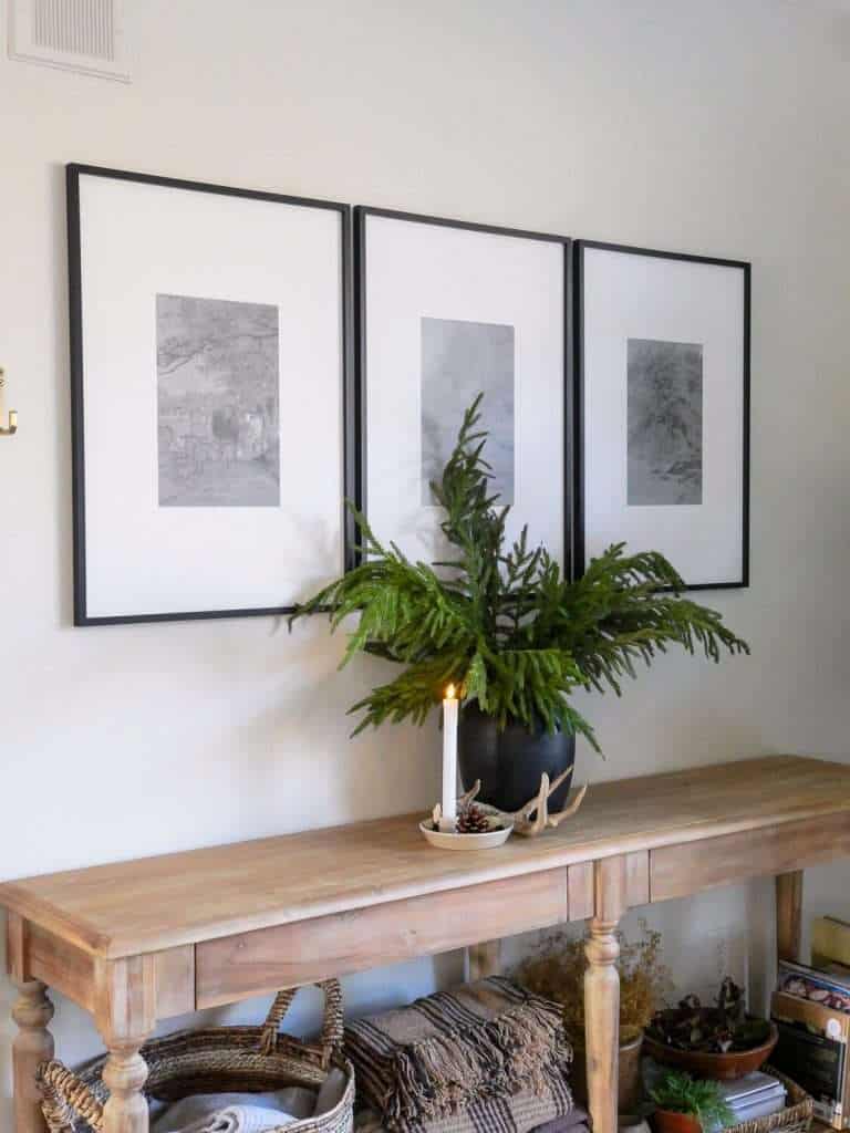 Single candle on a console table.