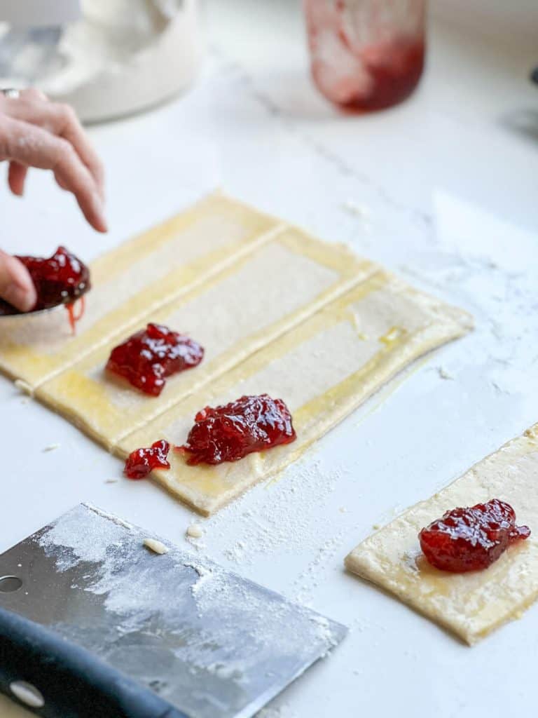 Adding filling to dough.