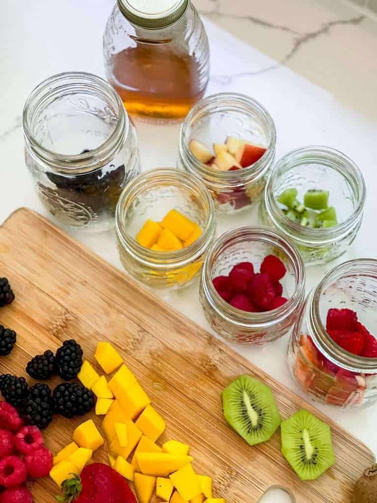 Prepping fruit for a honey parfait.