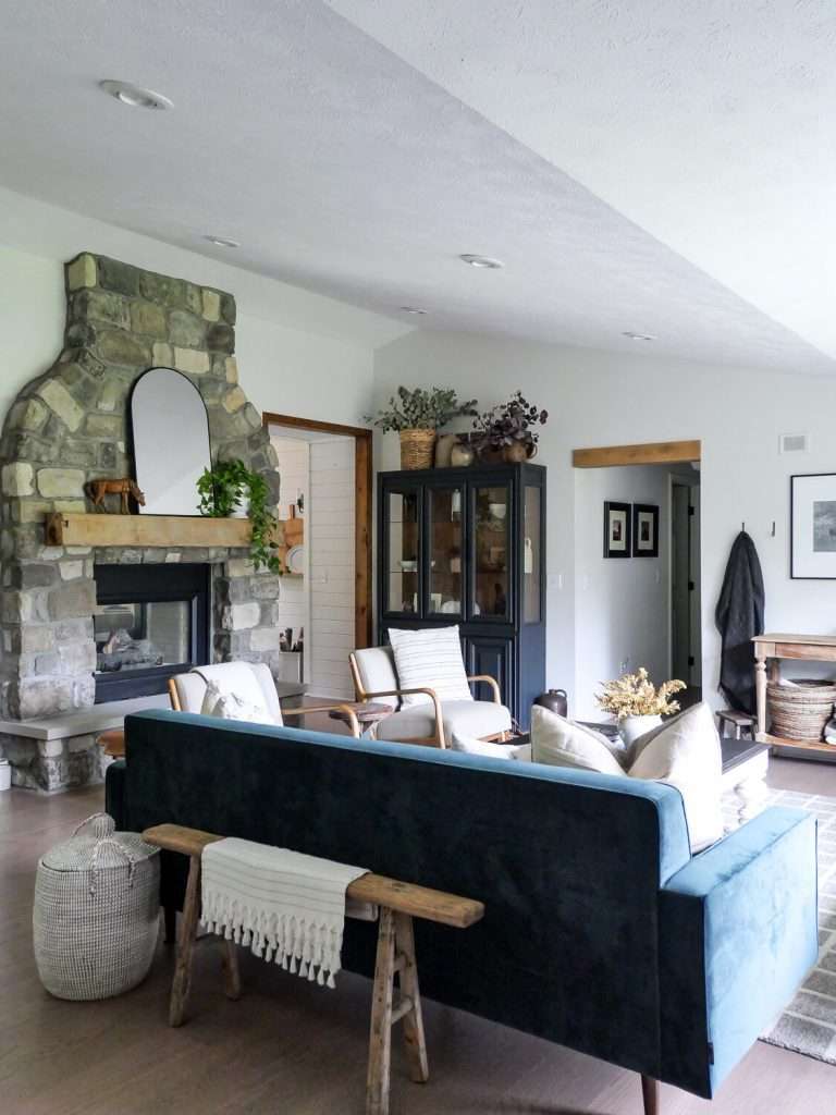 Stone fireplace in an organic modern living room.