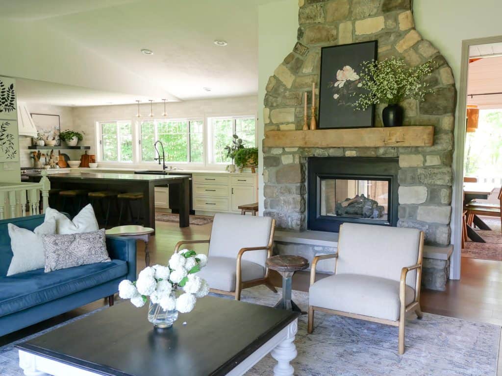 Living room with a stone fireplace.