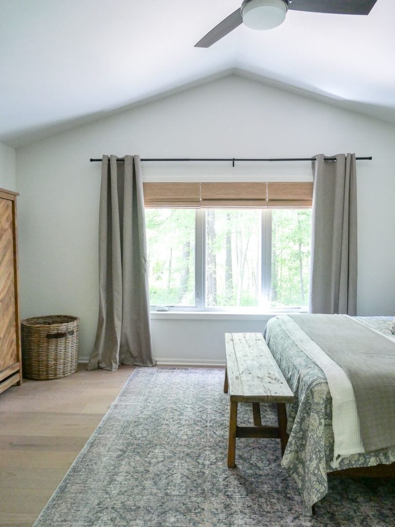 Big window in a bedroom.