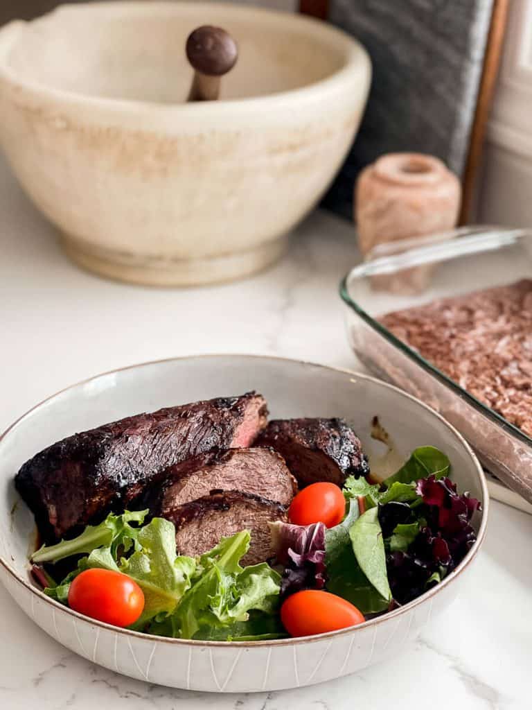 Venison tenderloin in a bowl.