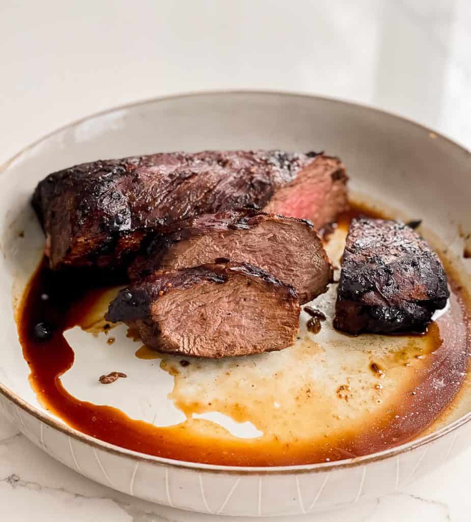 Venison tenderloin in a dish.