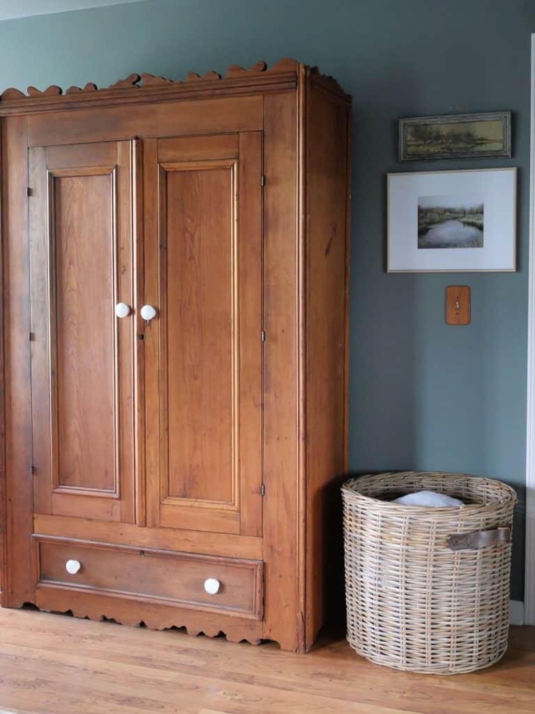 Antique wardrobe in a bedroom.